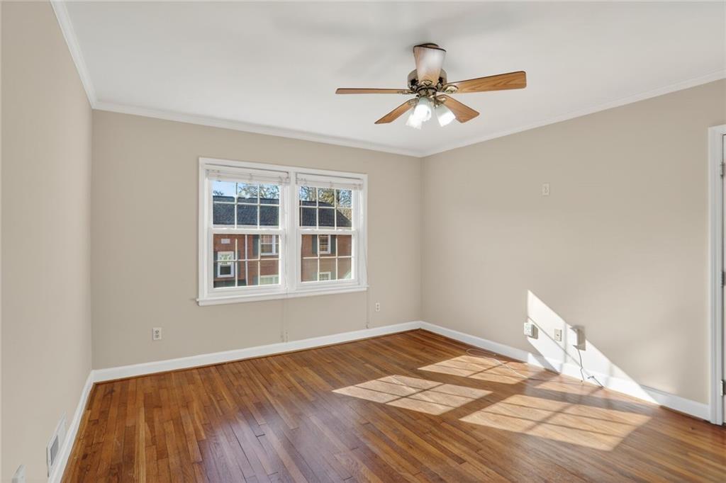 578 Goldsboro Road Northeast, Unit D Atlanta, GA 30307 - Photo 3 of 20 a view of a room with wooden floor and chandelier fan