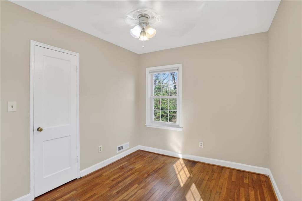 578 Goldsboro Road Northeast, Unit D Atlanta, GA 30307 - Photo 10 of 20 wooden floor in an empty room with a window