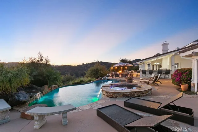 a view of a swimming pool with a yard