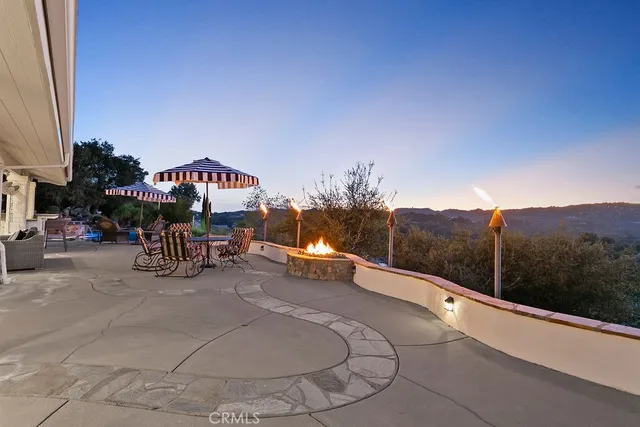 a view of a house with a patio and a garage