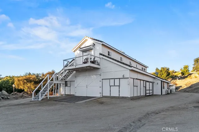 a view of a lake with mountains and valleys in the background