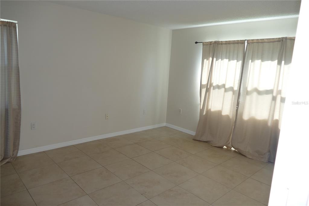 205 South McMullen Booth Road, Unit 203 Clearwater, FL 33759 - Photo 11 of 12 an empty room with windows