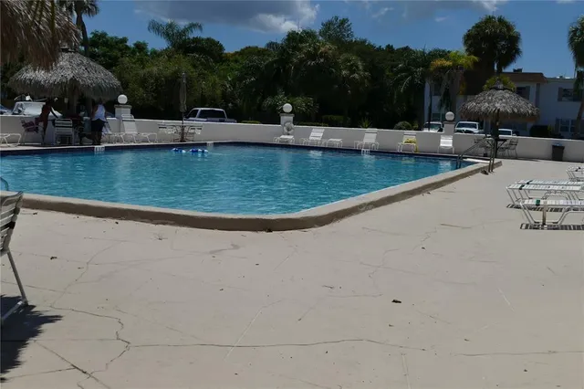a view of a swimming pool with a patio