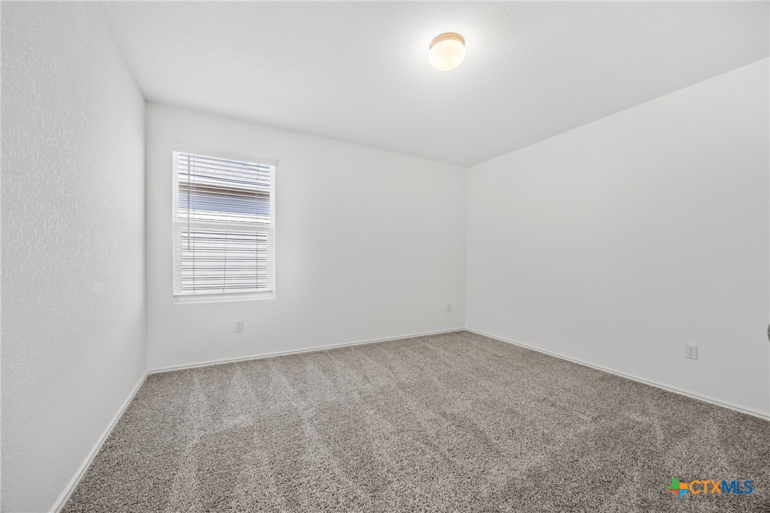 141 Rowdy Yates Way Jarrell, TX 76537 - Photo 18 of 32 an empty room with a window