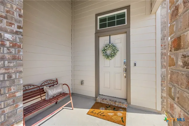 a view of a door and chair in the room