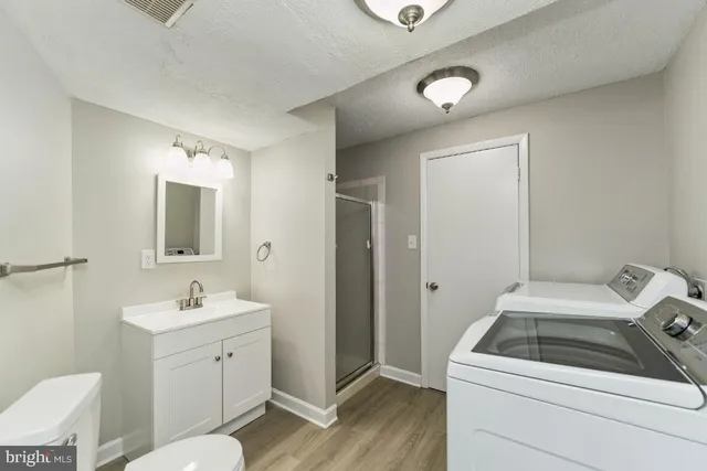 a view of an empty room with windows