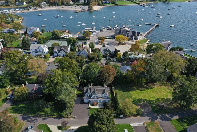 an aerial view of house with yard swimming pool and outdoor seating