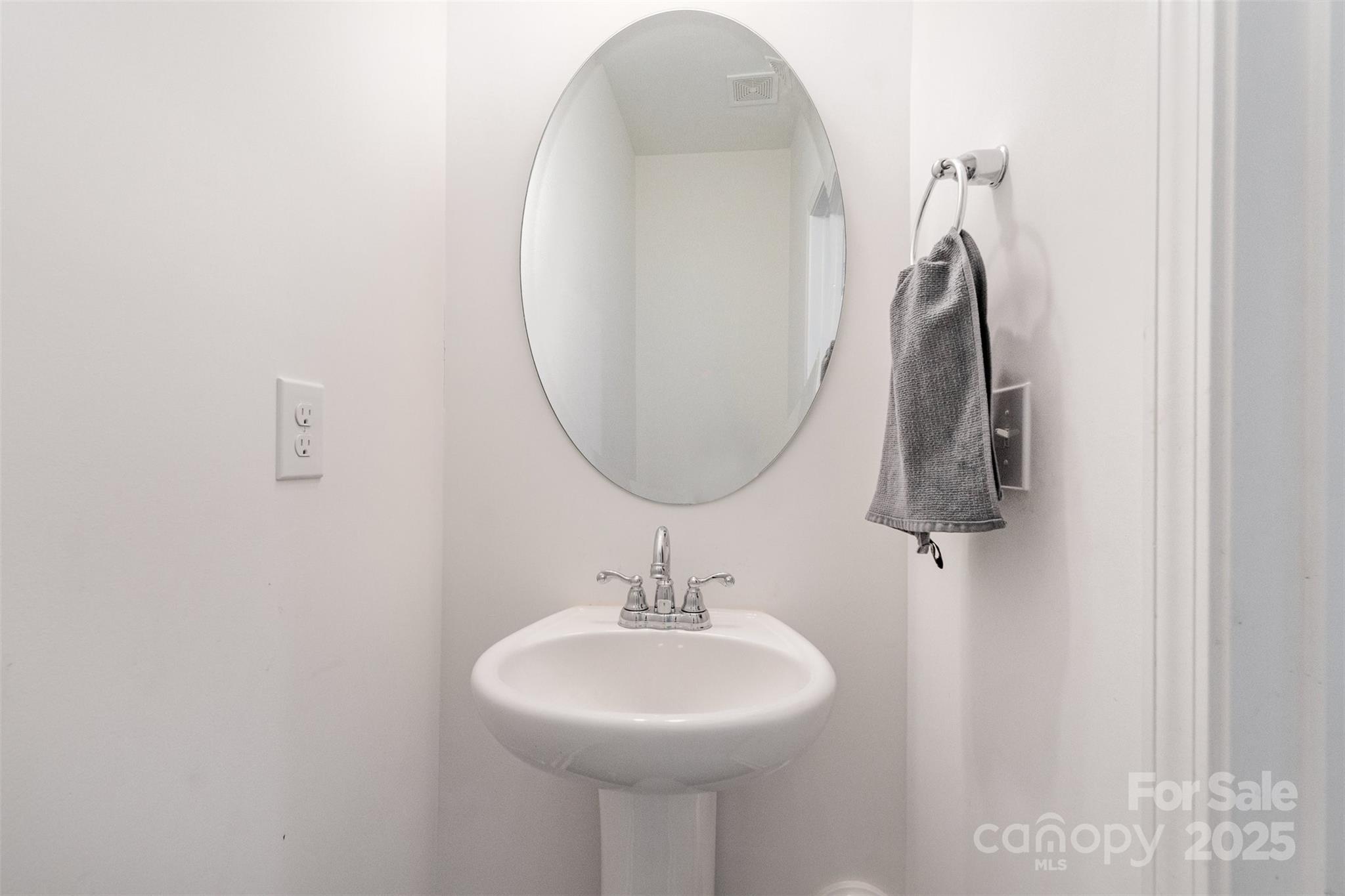 3127 Pinehills Wy. Mount Holly, NC 28120 - Photo 12 of 35 a bathroom with a sink and a mirror