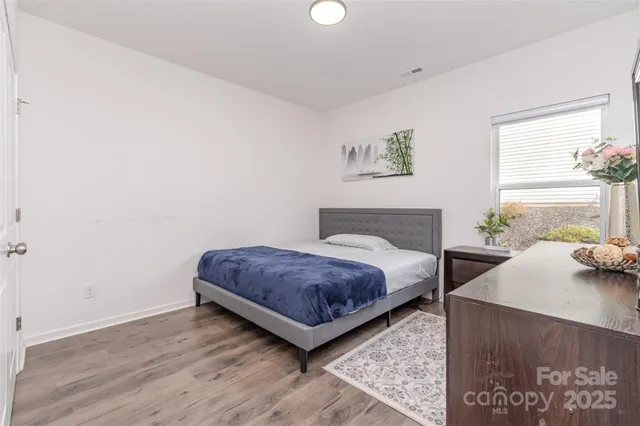 a bedroom with a bed and a closet