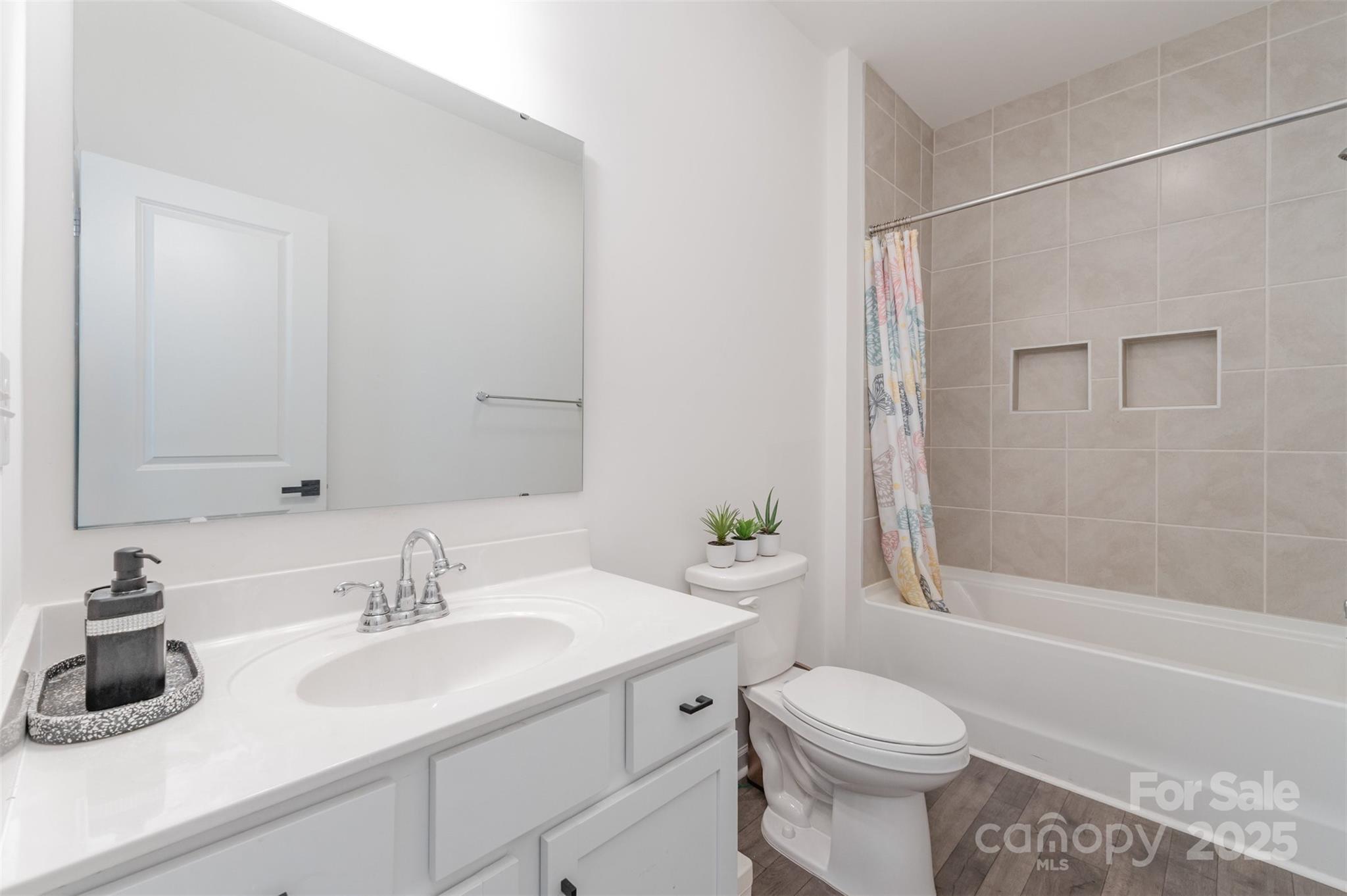 3127 Pinehills Wy. Mount Holly, NC 28120 - Photo 15 of 35 a bathroom with a sink toilet and shower