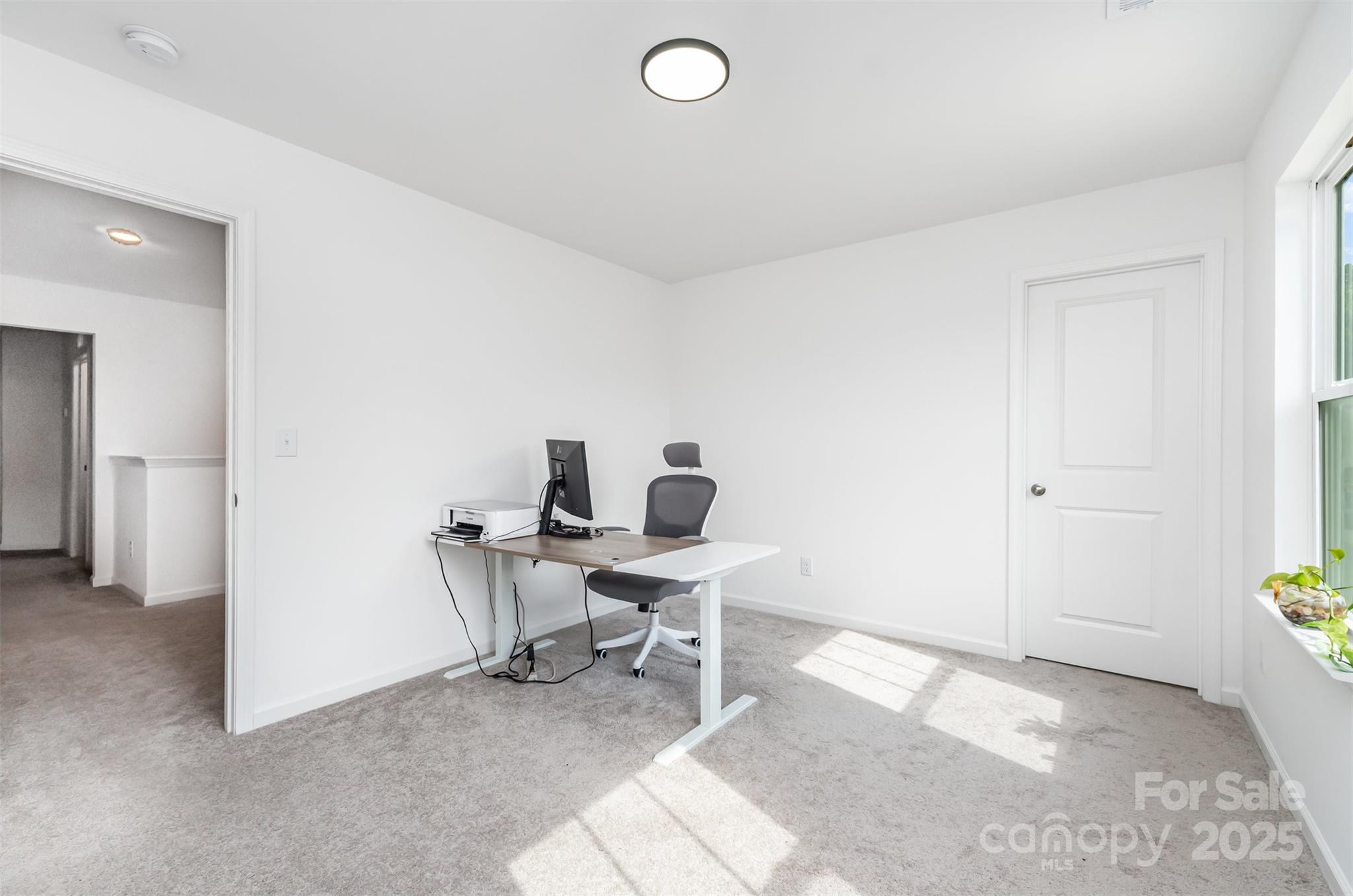 3127 Pinehills Wy. Mount Holly, NC 28120 - Photo 20 of 35 a view of a workspace with furniture and a window