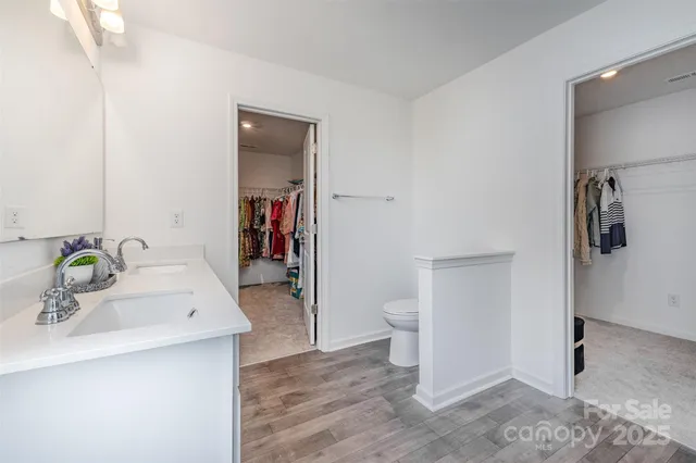 a bedroom with a bed and a chair