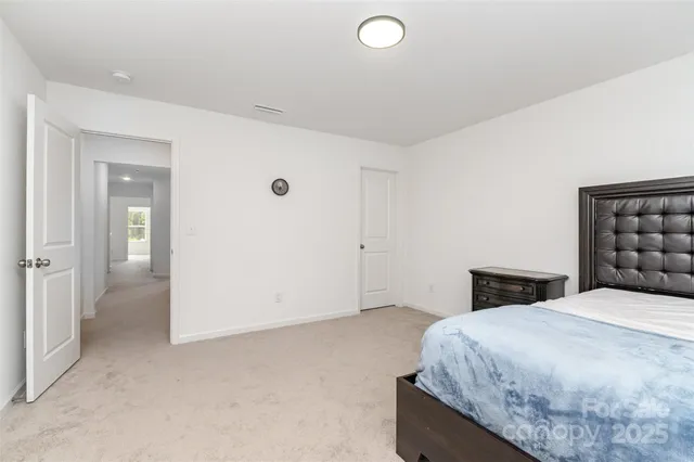 a bathroom with a sink toilet vanity and shower
