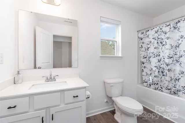a view of a porch with furniture and garden