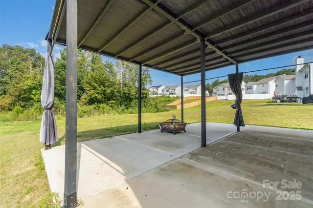 a view of an house with backyard porch and sitting area