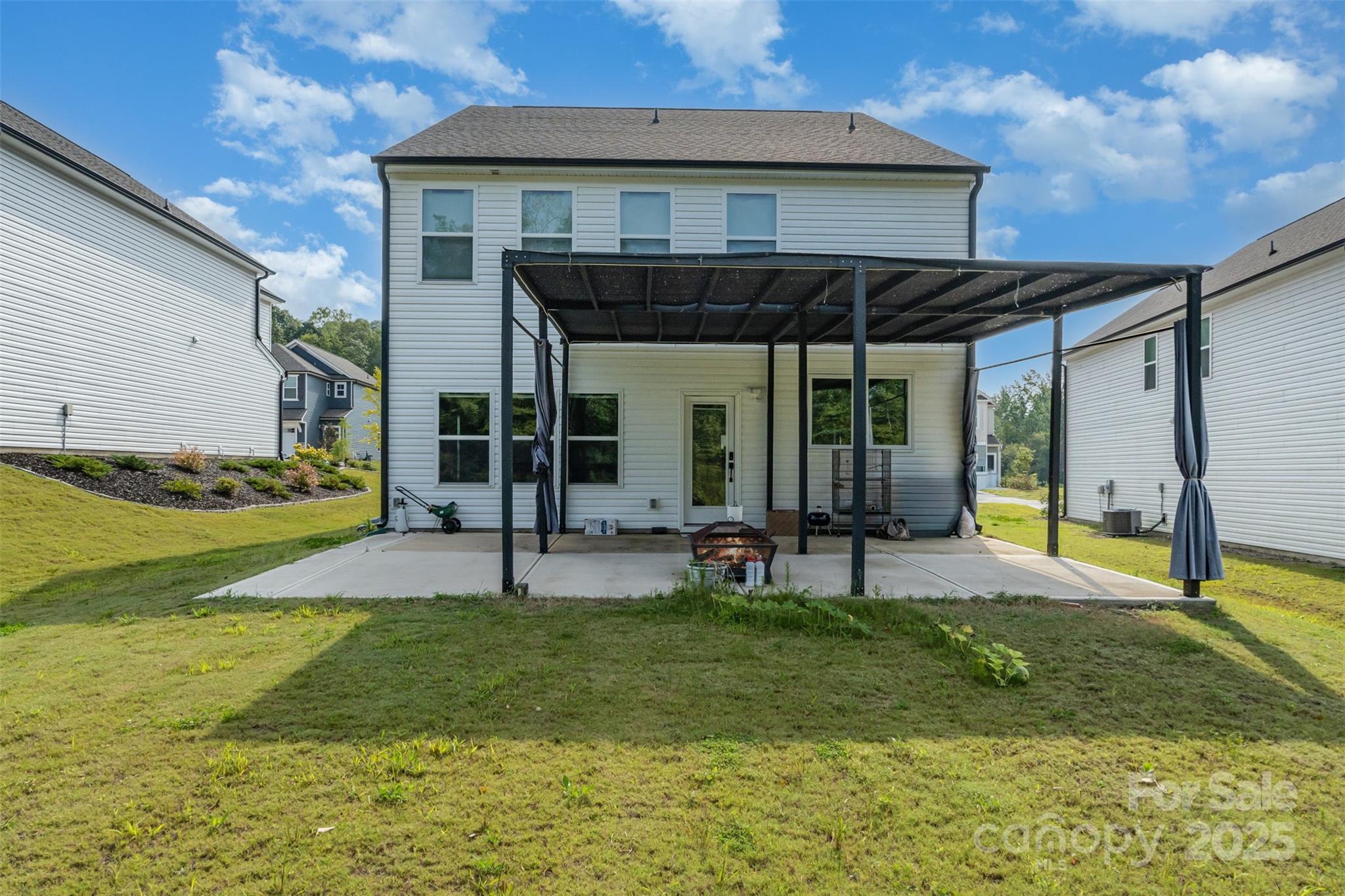 3127 Pinehills Wy. Mount Holly, NC 28120 - Photo 33 of 35 a view of an house with backyard porch and sitting area