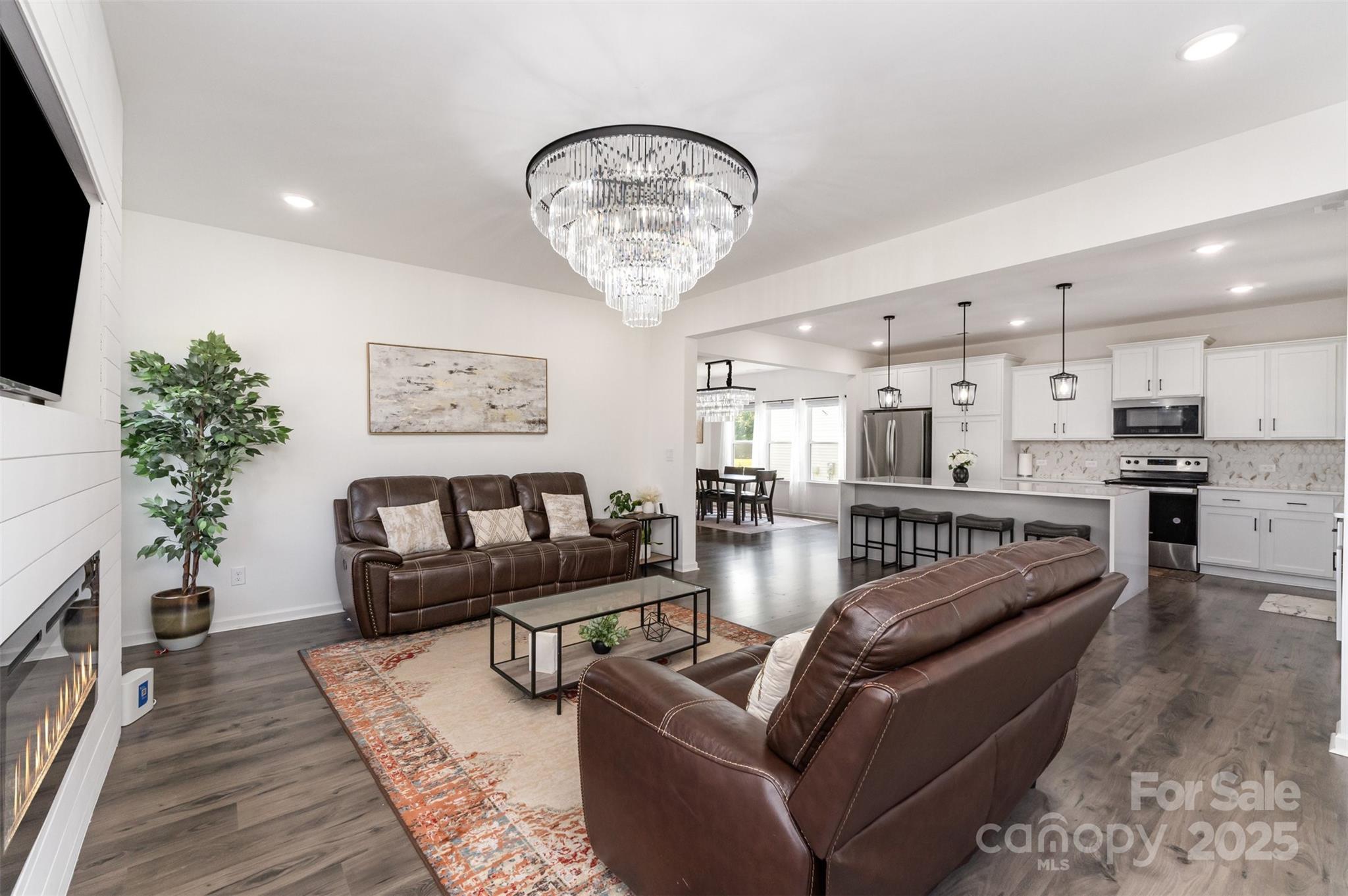 3127 Pinehills Wy. Mount Holly, NC 28120 - Photo 9 of 35 a living room with furniture and a chandelier