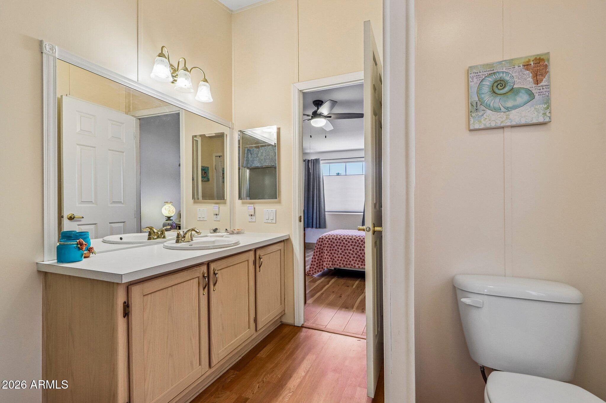 114 South Pinecrest Road Payson, AZ 85541 - Photo 19 of 40 a en suite bathroom with a toilet sink and mirror