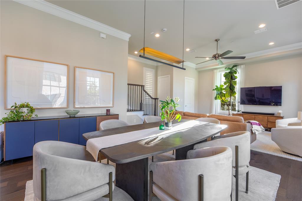 4116 Runyon Road Addison, TX 75001 - Photo 11 of 31 a view of a dining room with furniture and a potted plant