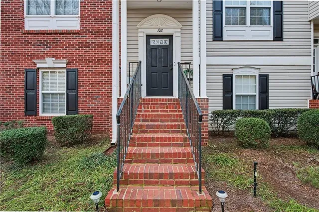 a view of a hallway with staircase