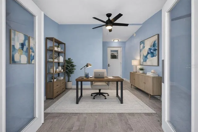 a view of a livingroom with wooden floor