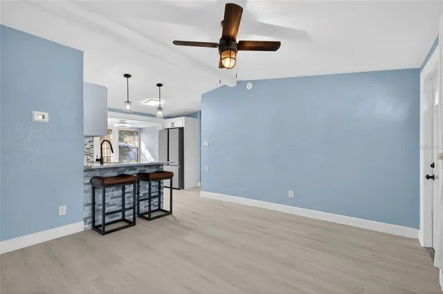 a view of kitchen with furniture and wooden floor