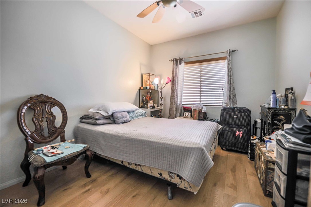 418 Finch Ridge Avenue North Las Vegas, NV 89032 - Photo 26 of 43 Bedroom featuring light wood finished floors and a ceiling fan