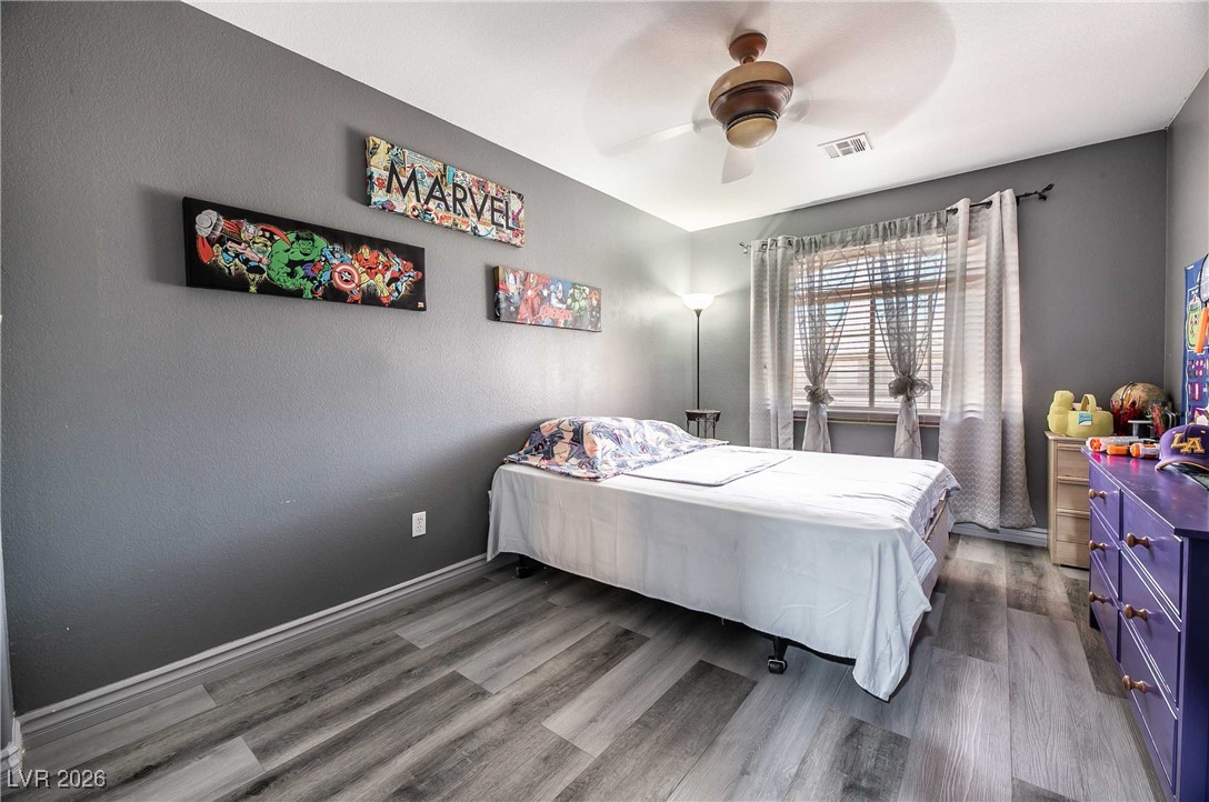 418 Finch Ridge Avenue North Las Vegas, NV 89032 - Photo 27 of 43 Bedroom featuring a ceiling fan and wood finished floors