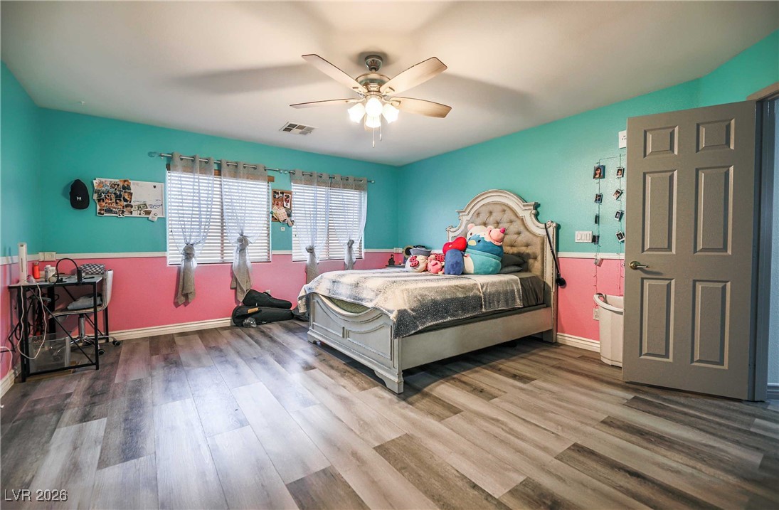 418 Finch Ridge Avenue North Las Vegas, NV 89032 - Photo 28 of 38 Bedroom with ceiling fan and wood finished floors