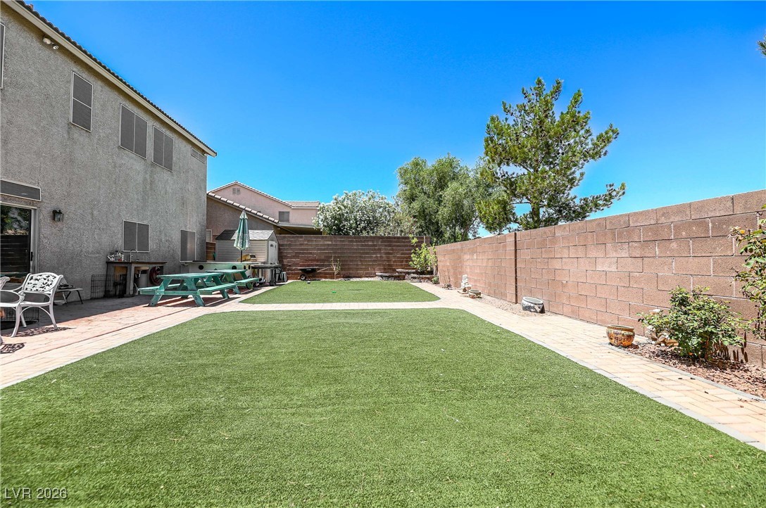 418 Finch Ridge Avenue North Las Vegas, NV 89032 - Photo 35 of 38 Fenced backyard with a patio