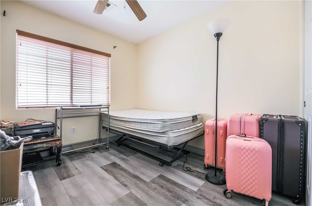 418 Finch Ridge Avenue North Las Vegas, NV 89032 - Photo 36 of 43 Bedroom featuring a ceiling fan and light wood-type flooring