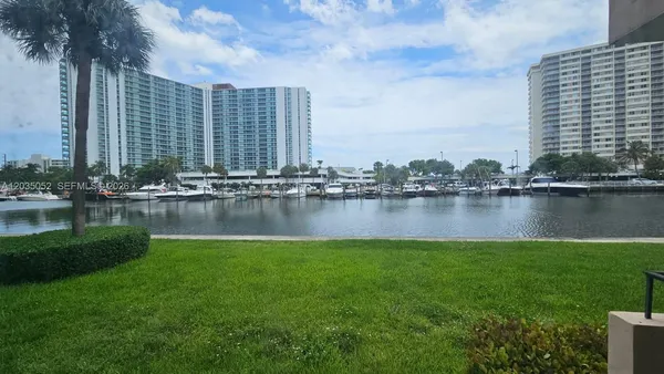 a view of lake with a city view