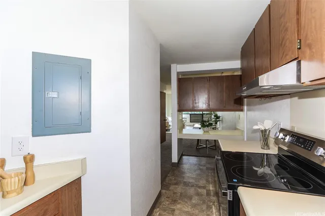 a kitchen with a sink and a stove top oven