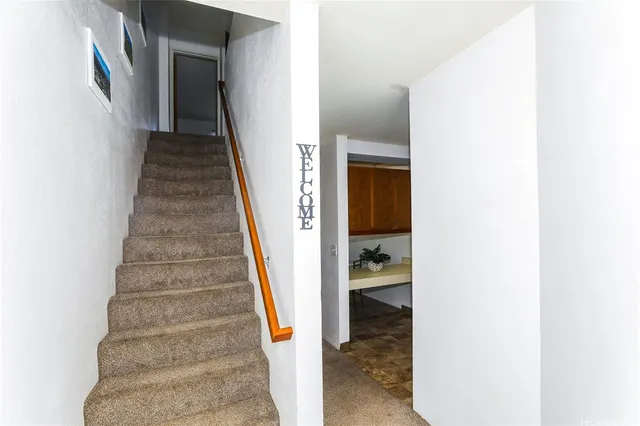 a view of a hallway with stairs