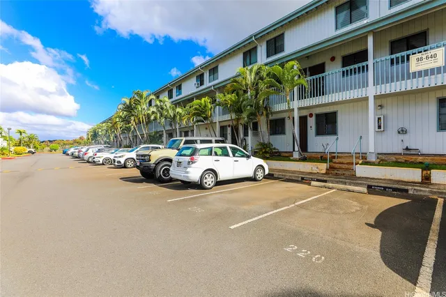 a view of a cars parked in front of a building