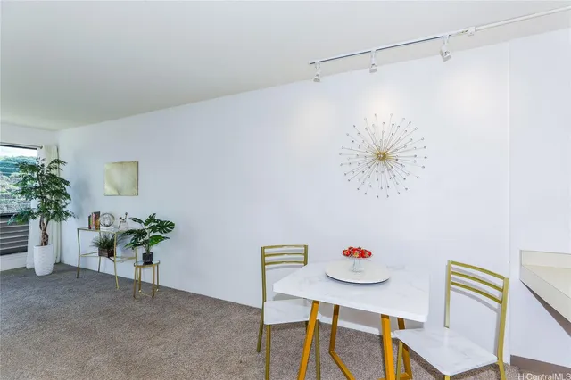 a view of kitchen with furniture and refrigerator