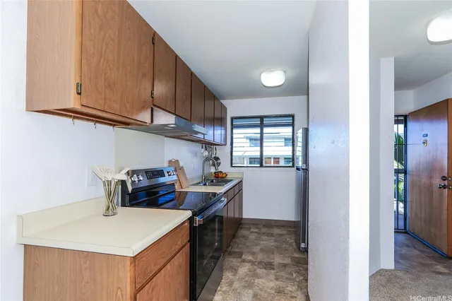 a kitchen that has a cabinets and a stove