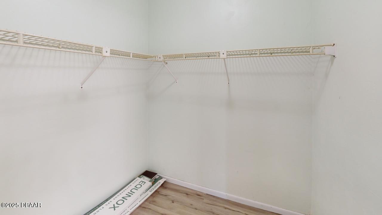 2219 Umbrella Tree Drive Edgewater, FL 32141 - Photo 13 of 22 a view of a room with racks on the wall