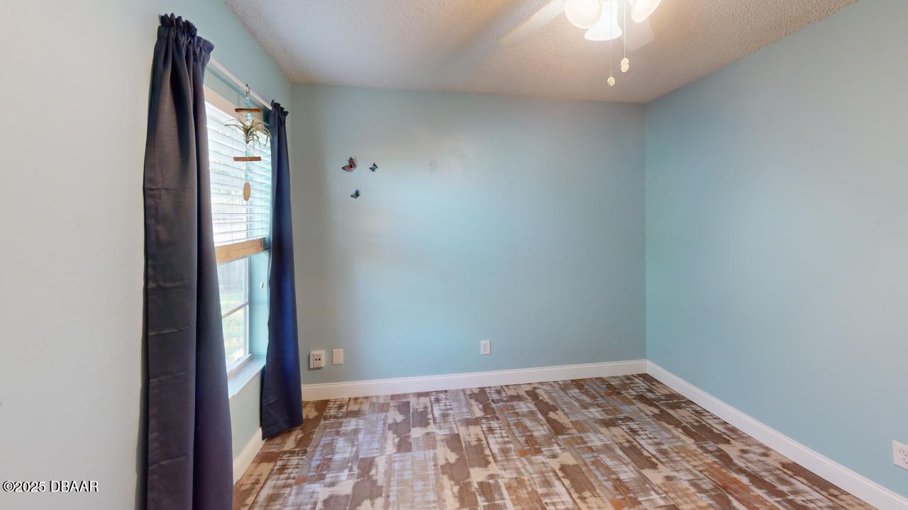 2219 Umbrella Tree Drive Edgewater, FL 32141 - Photo 14 of 22 an empty room with a window