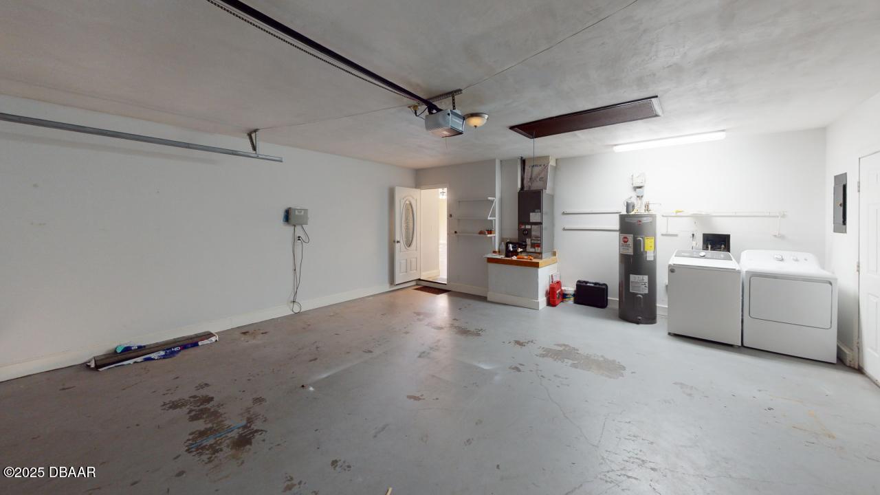 2219 Umbrella Tree Drive Edgewater, FL 32141 - Photo 21 of 22 a view of a storage & utility room with washer and dryer