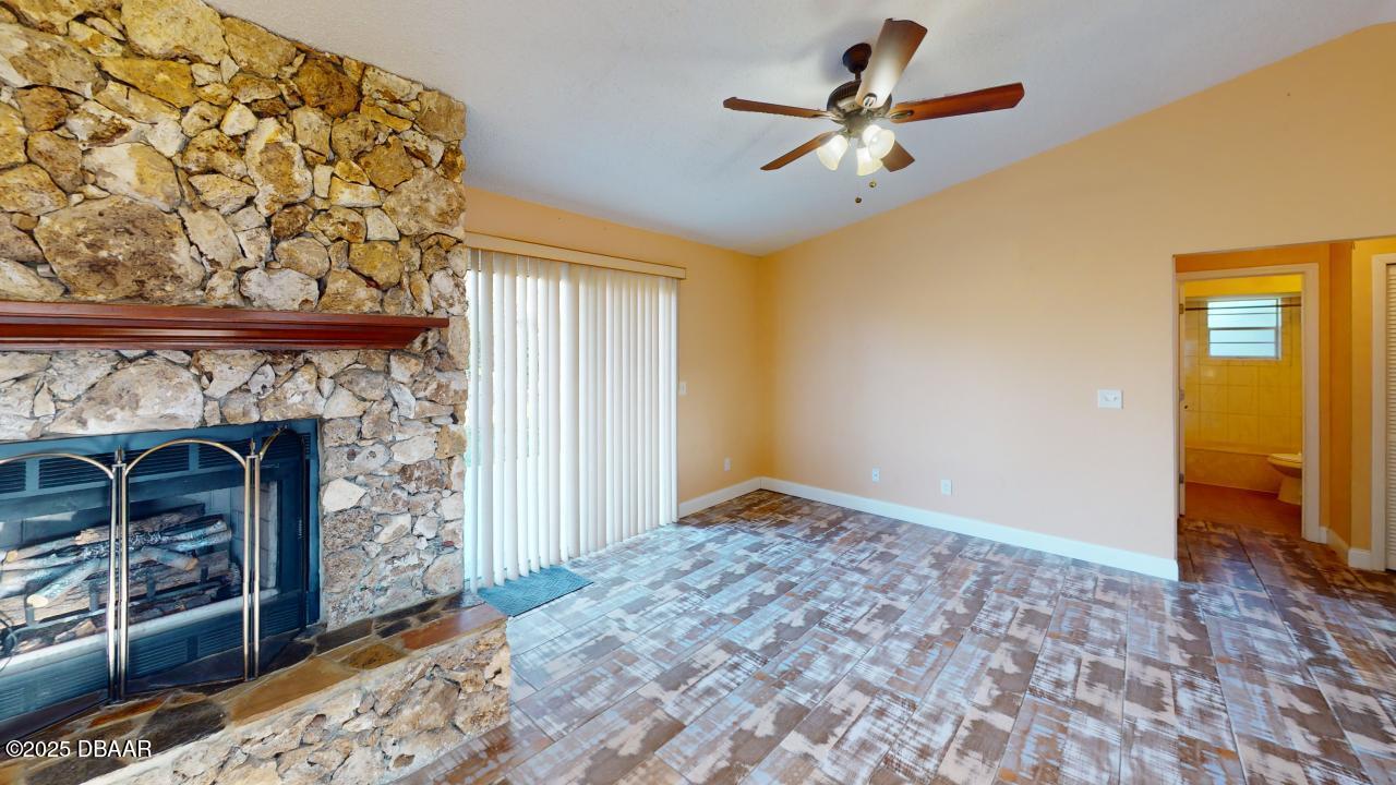 2219 Umbrella Tree Drive Edgewater, FL 32141 - Photo 8 of 22 a view of an empty room with a fireplace