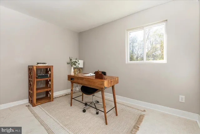 a workspace with furniture and window