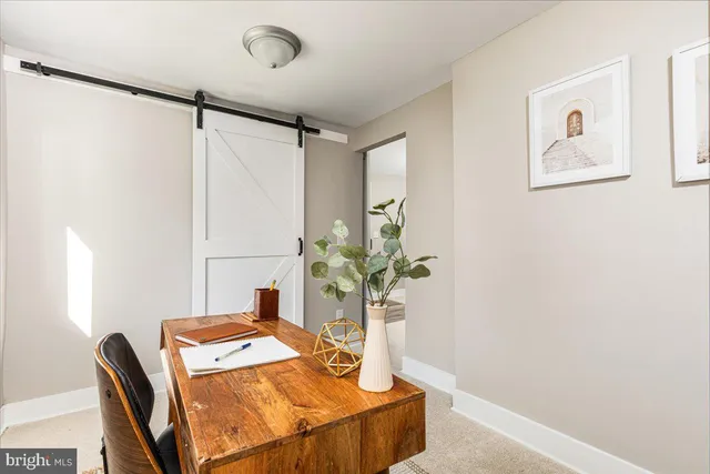 a dining room with table and chairs