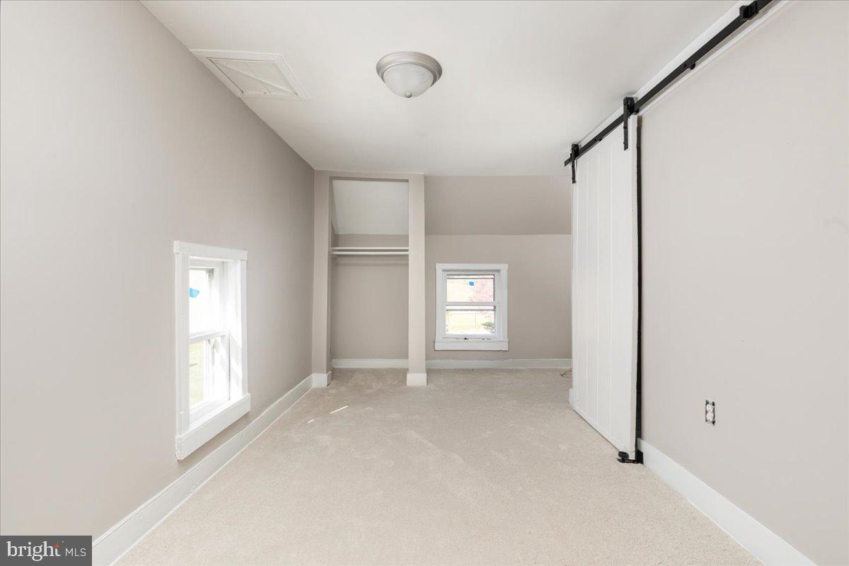 13886 Crest Hill Road Flint Hill, VA 22627 - Photo 19 of 45 a view of an empty room with a window