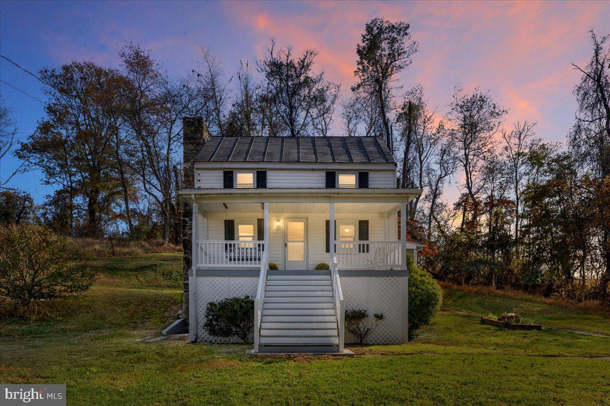 13886 Crest Hill Road Flint Hill, VA 22627 - Photo 2 of 45 a front view of a house with a yard