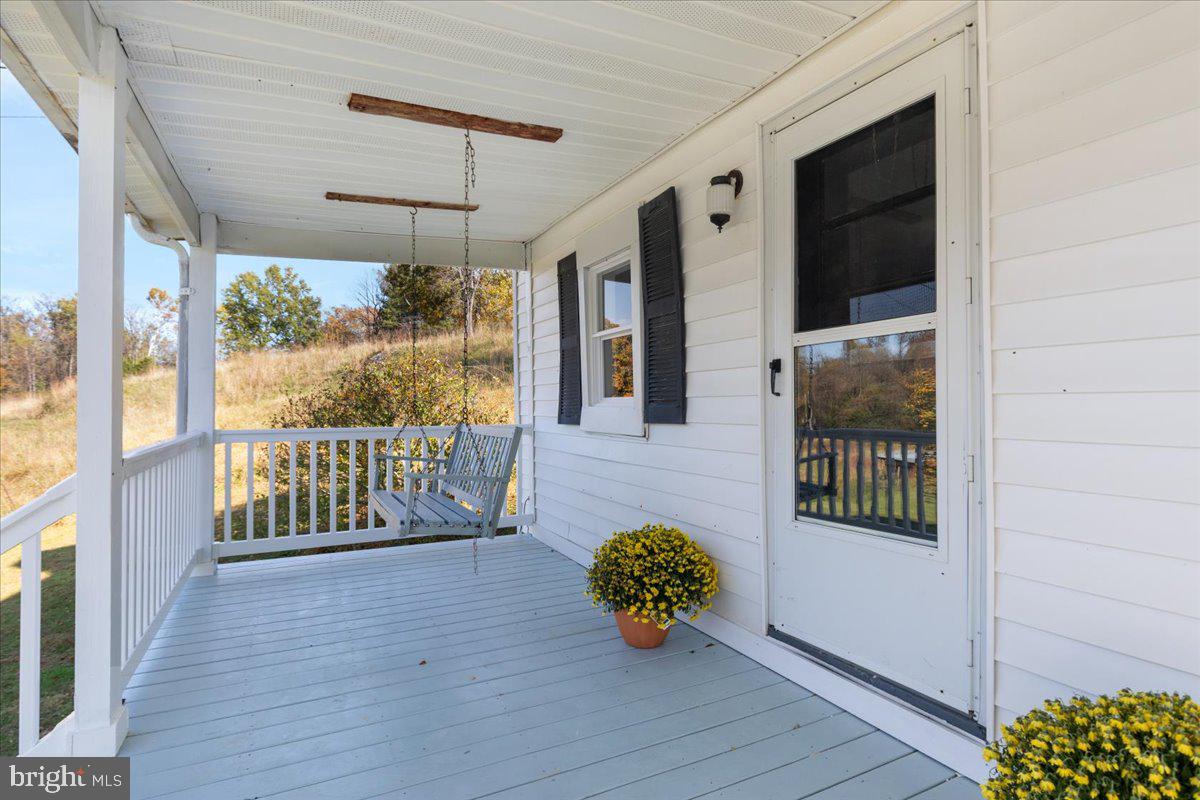 13886 Crest Hill Road Flint Hill, VA 22627 - Photo 25 of 45 a view of an outdoor space with wooden floor and a balcony