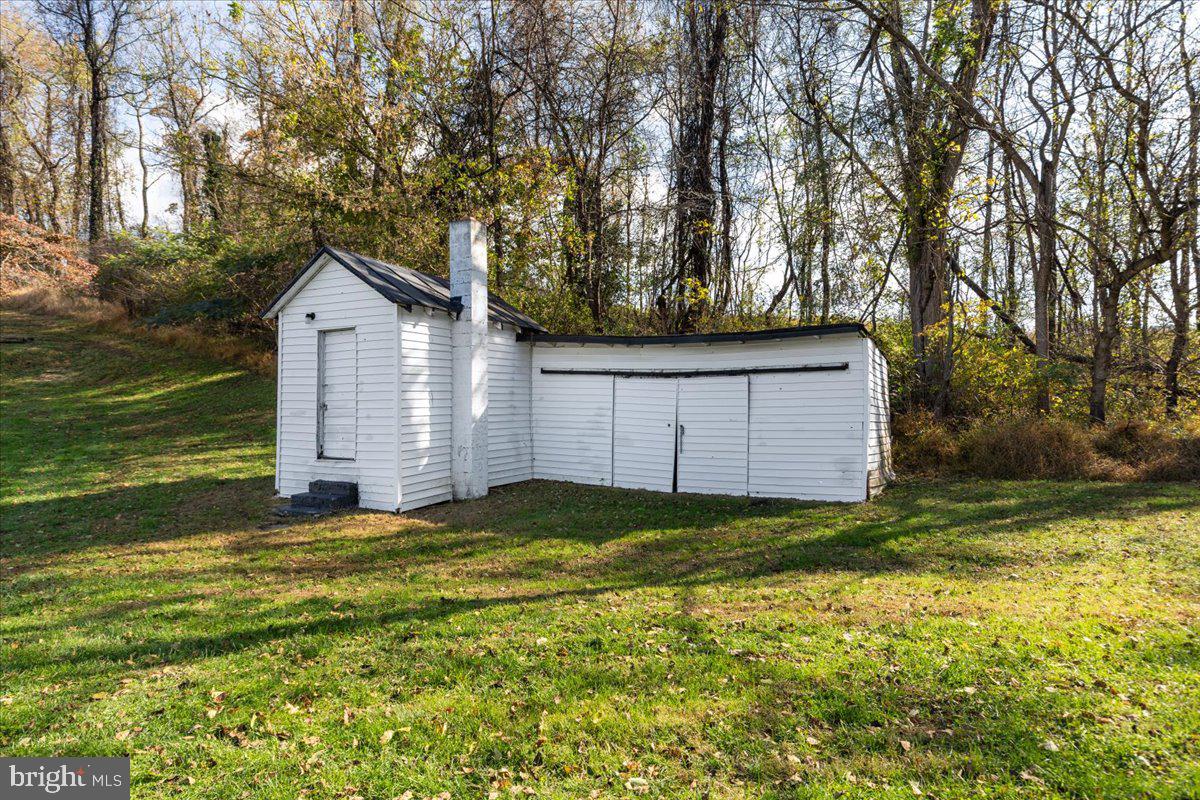 13886 Crest Hill Road Flint Hill, VA 22627 - Photo 29 of 45 a view of a house with a yard