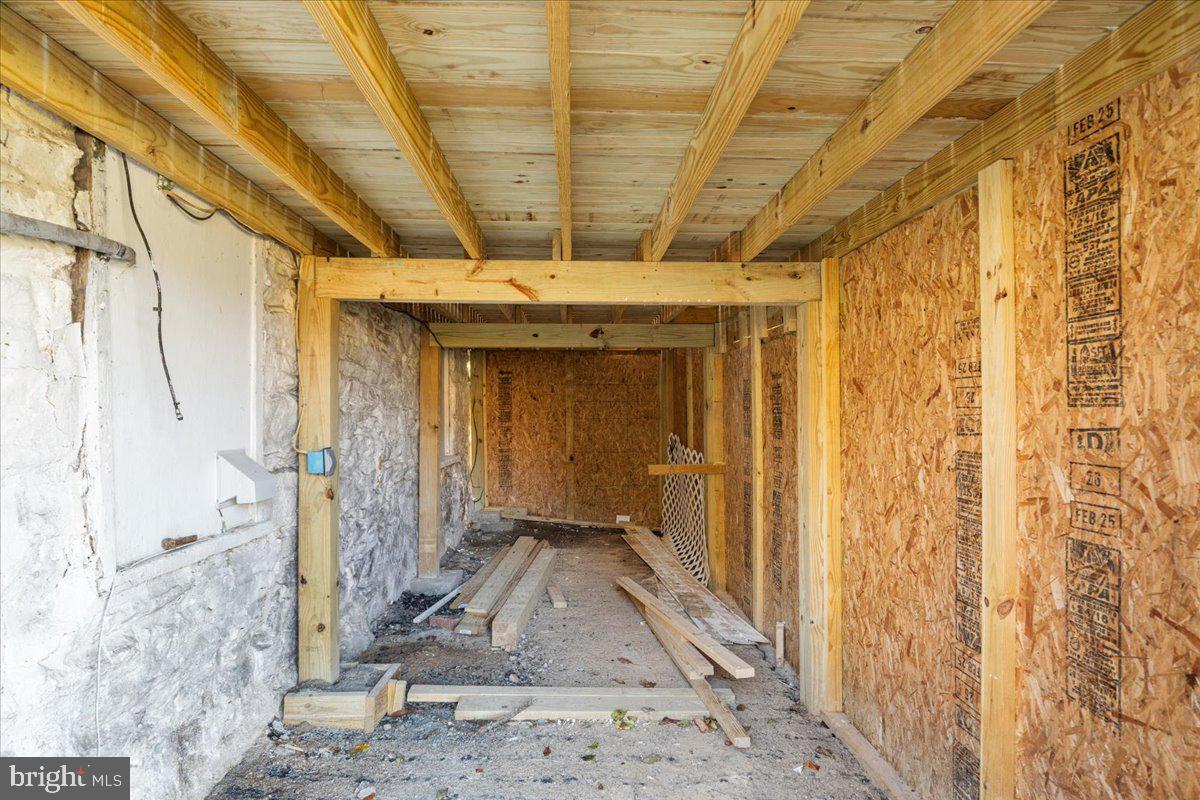 13886 Crest Hill Road Flint Hill, VA 22627 - Photo 30 of 45 a view of a porch with a wooden door