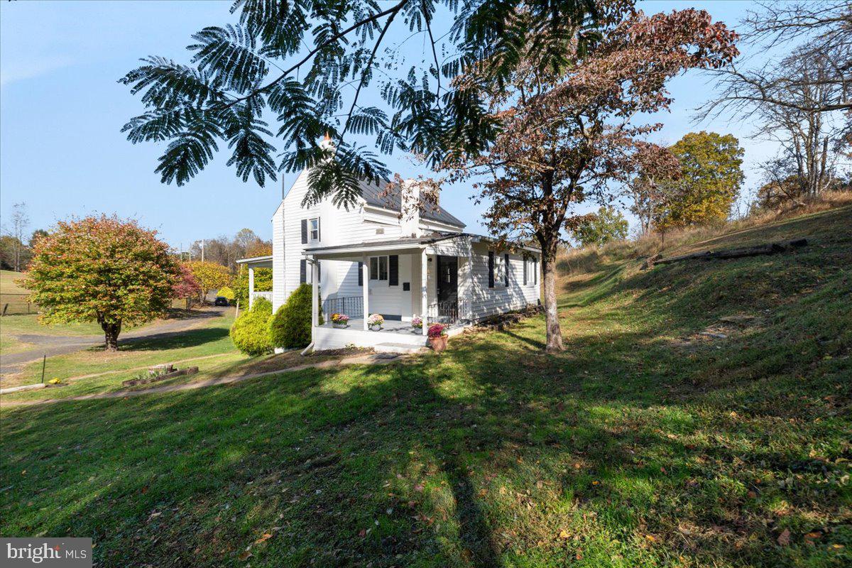13886 Crest Hill Road Flint Hill, VA 22627 - Photo 31 of 45 a view of a house with a yard