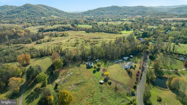an aerial view of residential house and outdoor space